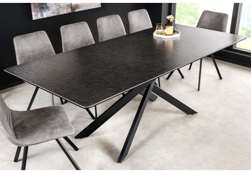 Rozkládací obdélníkový jídelní stůl Tramontana s antracitovou černou vrchní deskou s mramorovým designem a černými kovovými překříženými nožičkami v industriálním stylu