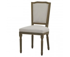 Luxusní čalouněná jídelní židle Antiquités Francaises ve venkovském stylu s ručně vyřezávaným zdobením na dřevěných nožičkách a opěrce v pískové šedé barvě s bílo šedým strukturovaným potahem