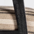 Luxusní designové křeslo Asta s proužkovaným čalouněním v odstínech hnědé a s černým dřevěným rámem 73 cm