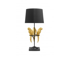 Designová glamour stolní lampa Macaw s černou konstrukcí a kulatým stínítkem s dekorací tří papoušků ve zlaté barvě na obruči