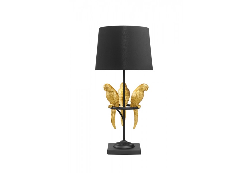 Designová glamour stolní lampa Macaw s černou konstrukcí a kulatým stínítkem s dekorací tří papoušků ve zlaté barvě na obruči