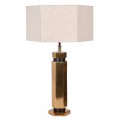 Designová art deco stolní lampa Anasa s kovovou podstavou v lesklé zlaté barvě šestiúhelníkového tvaru a textilním lněným stínítkem ve světlé béžové barvě ve tvaru šestiúhelníku