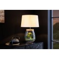 Stylov&aacute; skleněn&aacute; stoln&iacute; lampa Clasico s nohou v podobě průsvitn&eacute; n&aacute;doby s v&aacute;lcov&yacute;m b&eacute;žov&yacute;m st&iacute;n&iacute;tkem 60 cm