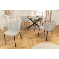 Designov&aacute; retro boucle j&iacute;deln&iacute; židle Olive v zelen&eacute; barvě s čern&yacute;mi nožičkami 75 cm