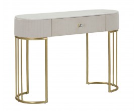 Luxusní glamour oválný konzolový stolek Glamia Tapisé se zásuvkou a vrchní deskou s designem bílého mramoru se sametovým potahem v krémové béžové barvě a dvěma polobloukovými nohama z kovu v metalické zlaté barvě