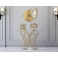Designový glamour konzolový stolek Papillon s obdélníkovou skleněnou deskou a zlatou kovovou podstavou ve tvaru motýla 110 cm