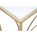 Designov&yacute; glamour konzolov&yacute; stolek Nastrillo se zrcadlovou vrchn&iacute; deskou a zlatou podstavou s ozdobn&yacute;mi oblouky 140 cm
