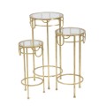 Designov&aacute; glamour sada kulat&yacute;ch př&iacute;ručn&iacute;ch stolků Solara se skleněnou deskou a zlat&yacute;m kovov&yacute;m r&aacute;mem s detaily 70 cm