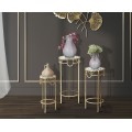 Designov&aacute; glamour sada kulat&yacute;ch př&iacute;ručn&iacute;ch stolků Solara se skleněnou deskou a zlat&yacute;m kovov&yacute;m r&aacute;mem s detaily 70 cm