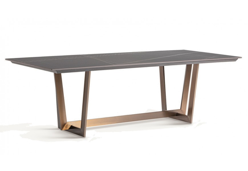 Luxusní glamour jídelní stůl Brilon s vrchní deskou z porcelánu s mramorovým designem v černé barvě s bílými žilkami s geometrickýma nohama v měděné barvě z kovu