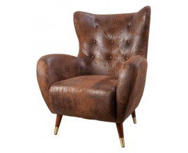Stylové art deco křeslo Bolte ve tvaru ušáku s eko koženým potahem v hnědé barvě s čalouněním a prošíváním s nožičkami s detailem z kovu ve zlaté barvě
