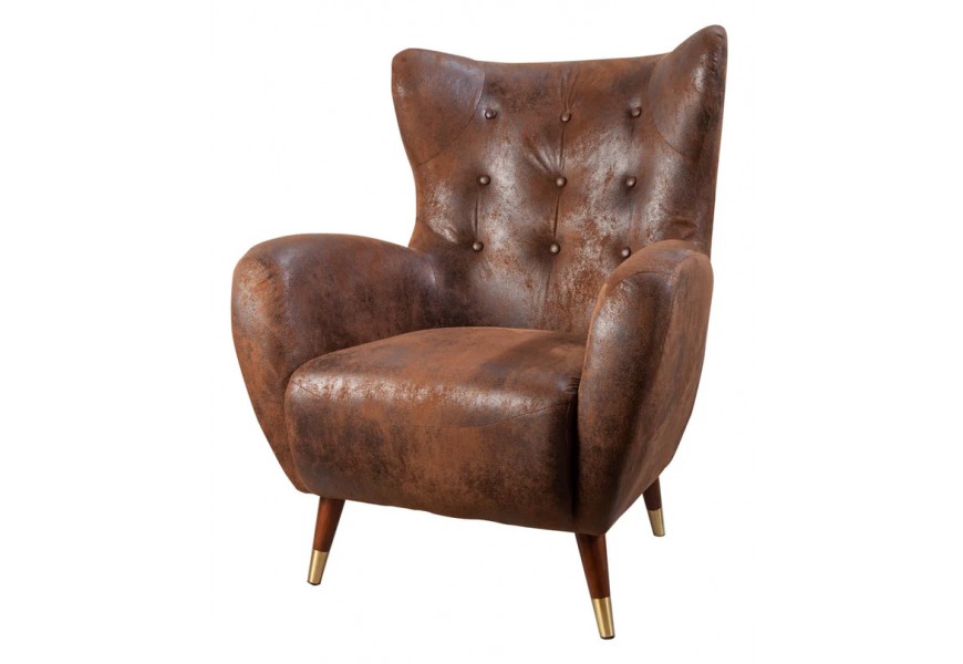 Stylové art deco křeslo Bolte ve tvaru ušáku s eko koženým potahem v hnědé barvě s čalouněním a prošíváním s nožičkami s detailem z kovu ve zlaté barvě