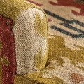 Luxusní etno orientálně čalouněné žluto červené vzorované křeslo Reria s hnědými masivními dřevěnými nožičkami 90 cm