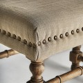 Luxusní koloniální dvoumístná šedá lavice Teria se lněným potahem s nýty s masivními hnědými vyřezávanými nožičkami 128 cm