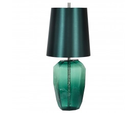 Art deco designová noční lampa Mistica v zelené smaragdové barvě se skleněnou průhlednou podstavou v nepravidelném tvaru s kovovými stříbrnými detaily a stínítkem z bavlny s lesklým povrchem ve válcovém tvaru