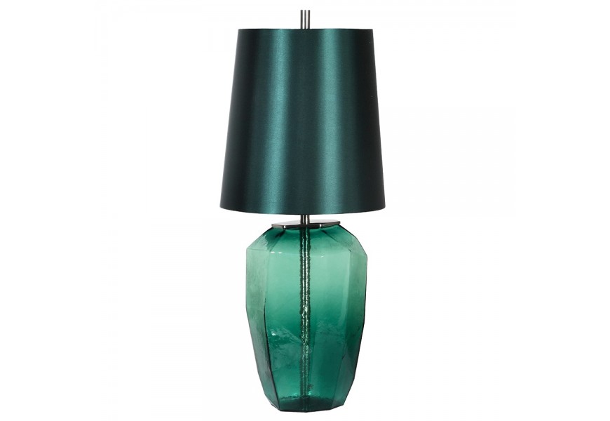Art deco designová noční lampa Mistica v zelené smaragdové barvě se skleněnou průhlednou podstavou v nepravidelném tvaru s kovovými stříbrnými detaily a stínítkem z bavlny s lesklým povrchem ve válcovém tvaru