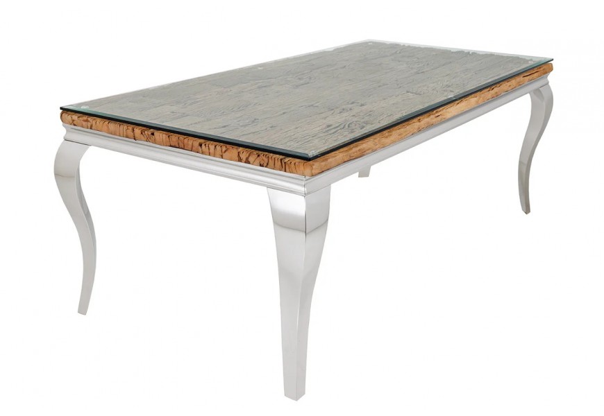 Luxusní glamour jídelní stůl Modern Barock s konstrukcí z kovu v lesklém chromovém stříbrném provedení s obdélníkovou vrchní deskou s vrstvou masivního teakového dřeva s výraznou strukturou v přírodní hnědé barvě překrytou průhledným bezpečnostním sklem