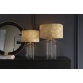 Designová glamour noční lampa Gambier se zlatým stínítkem se vzorem palmových listů a průhlednou skleněnou nohou 47 cm