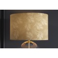 Designová glamour noční lampa Gambier se zlatým stínítkem se vzorem palmových listů a průhlednou skleněnou nohou 47 cm