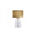 Designová skleněná stolní lampa Gambier s průhlednou oblou nohou a konstrukcí z kovu ve zlaté barvě s kulatým textilním stínítkem ve zlaté barvě s asymetrickým vzorem palmových listů