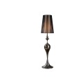 Glamour designová lampa Lucie Schwarz s lesklou černou kovovou nohou se stupňovitým tvarem a vysokým kulatým průsvitným nylonovým stínítkem s bílým podsítím