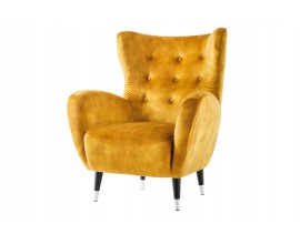 Designové retro glamour sametové žluté křeslo ušák Bolte s vysokou zádovou opěrkou s prodlouženými rohy s prošíváním s kulatými knoflíky se zaoblenými bočními opěrkami a šikmými černými nožičkami se stříbrným detailem