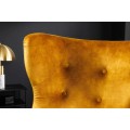 Art deco křeslo Bolte s hořčicovým žlutým sametovým potahem a vysokou zádovou opěrkou s designem ušáku 106 cm