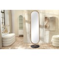 Art deco šatní zrcadlo Auri stojící oválné se zlatým kovovým rámem a černou kulatou podstavou s dýhou 172 cm