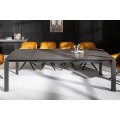 Obdélníkový rozkládací jídelní stůl s tmavou keramickou deskou a kovovými nohami