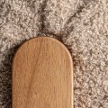 Produkt Luxusní retro béžové křeslo Aliona s bouclé potahem a masivní dřevěnou hnědou konstrukcí 89 cm