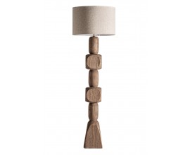 Luxusní masivní stojací lampa Ninewe s podstavou ze šesti vyřezávaných geometrických prvků z mangového dřeva v naturální hnědé barvě s válcovitým stínítkem v béžové barvě z přírodního jutového vlákna