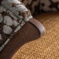Luxusní designové čalouněné křeslo Brilon s hnědým dřevěným rámem a žlutým sedátkem se vzorovanou hnědobílou opěrkou 80 cm
