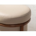 Luxusní moderní kulatá taburetka Vita Naturale v béžovým koženým potahem a hnědou designovou konstrukcí 40 cm