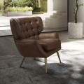 Luxusní moderní křeslo Sayron s tmavým hnědým potahem z pravé kůže s chesterfield prošíváním a zlatýma nohama 85 cm