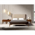 Luxusní moderní manželská postel Charmoin s béžovým čalouněným čelem z ekokůže s ořechově hnědým masivním rámem 188 cm