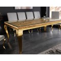Moderní glamour barokní jídelní sestava nábytku židlí s šedým sametovým čalouněním a stolem se skleněnou deskou a kabriolovými nožičkami ve zlaté barvě