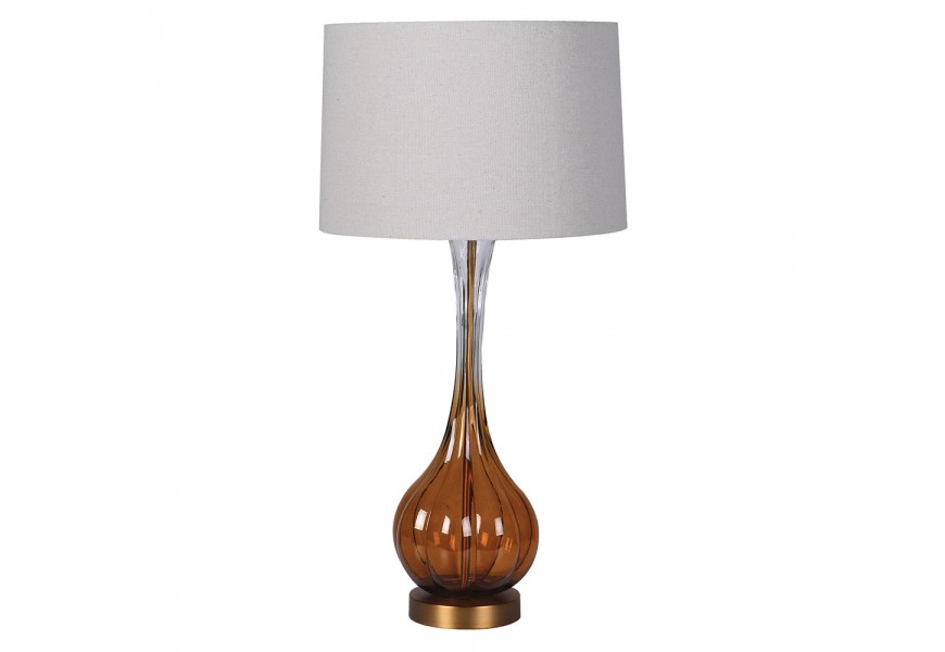 Glamour retro stolní lampa Antari s podstavou ze skla s hnědým tónováním ve spodní části s kovovou konstrukcí ve zlaté barvě s kulatým stínítkem ze lnu v béžové barvě
