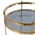 Designový art deco kulatý servírovací vozík Tianna se zlatou kovovou konstrukcí a dvěma skleněnými policemi 90 cm