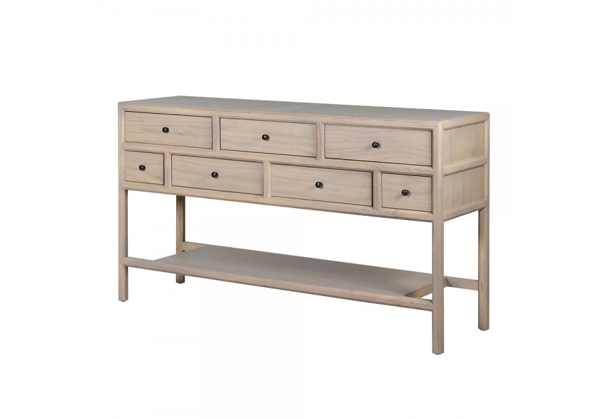 Luxusní moderní masivní obdélníkový konzolový stolek Angus se sedmi zásuvkami s černými kulatými úchyty ve dvou řadách s dlouhými štíhlými nožičkami a velkou policí ve spodní části z masivního jilmového dřeva ve světlém hnědém krémovém provedení