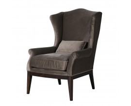 Luxusní vintage šedé křeslo Jude v taupu odstínu se sametovým potahem a polštářem s vysokou zádovou opěrkou s bočnicemi a podstavou se čtyřmi nohama ze dřeva v tmavém hnědém lakování