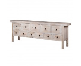 Luxusní vintage příborník Thyon s jedenácti zásuvkami ve dvou řadách s černými kulatými úchyty na dlouhých hranatých nožičkách s obdélníkovou vrchní deskou z masivního recyklovaného dřeva ve světlé hnědé povrchové úpravě se starožitným efektem vymytého krémového nátěru