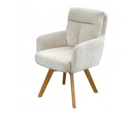 Modern&iacute; skandin&aacute;vsk&eacute; j&iacute;deln&iacute; křeslo Dover s čalouněn&iacute;m a potahem z žinylkov&eacute; textilie v kr&eacute;mov&eacute; b&eacute;žov&eacute; barvě s otočn&yacute;m sed&aacute;kem a opěrkami na ruce s pro&scaron;&iacute;van&yacute;m opěrkov&yacute;m pol&scaron;t&aacute;řem a masivn&iacute;mi nohama z bukov&eacute;ho dřeva v natur&aacute;ln&iacute; světle hněd&eacute; barvě